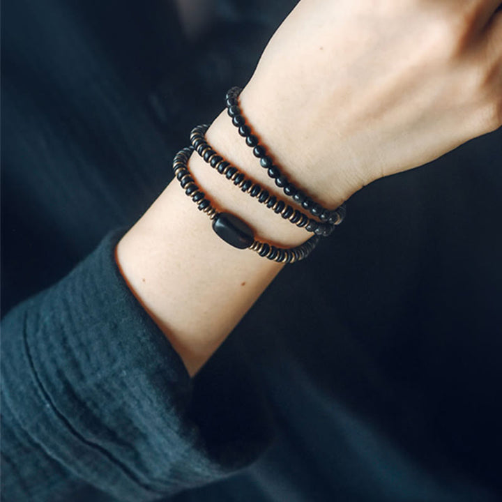 Pulsera de triple envoltura curativa de cobre y madera de ébano, obsidiana arcoíris con Buddha Stones
