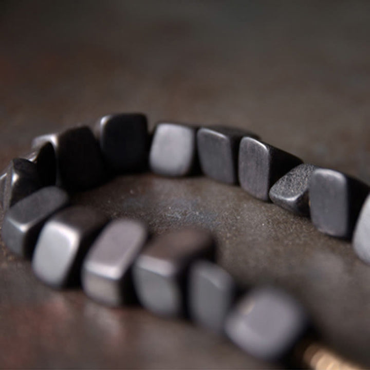 Pulsera de doble envoltura de paz de cobre y madera de ébano tibetano con Buddha Stones