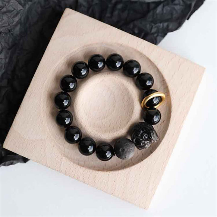 Pulsera de fuerza de león de obsidiana con brillo plateado de obsidiana negra