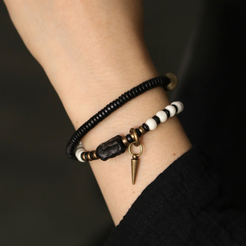 Pulsera de pareja con Buddha Stones, cuentas de hueso, madera de ébano y cobre.