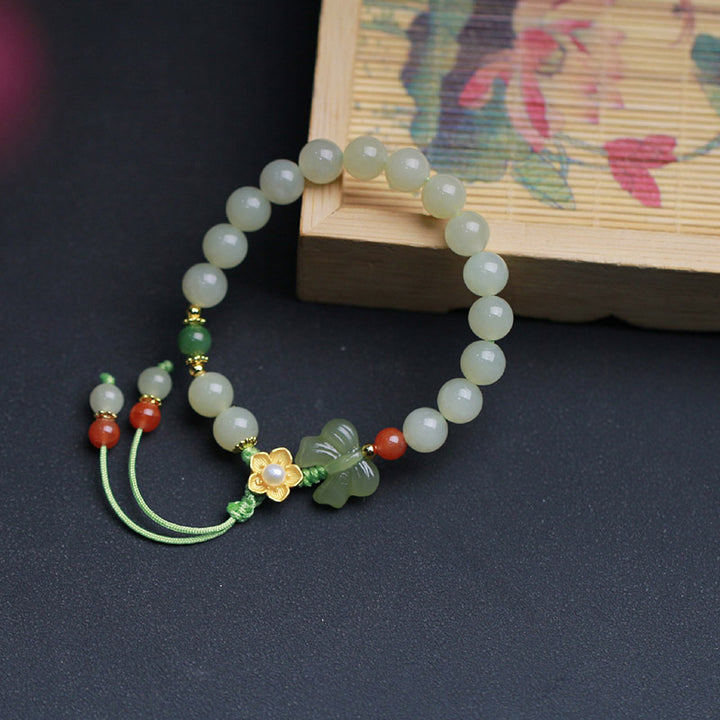Pulsera de mariposa y flor de la suerte de jade de plata de ley 925 con Buddha Stones