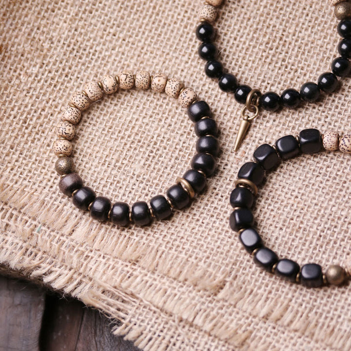 Pulsera de paz de cobre y madera de ébano, obsidiana negra, semilla de Bodhi tibetana, Buddha Stones