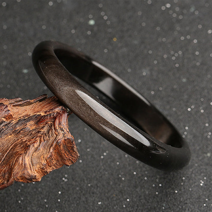 Brazalete de protección de obsidiana con brillo dorado y Buddha Stones