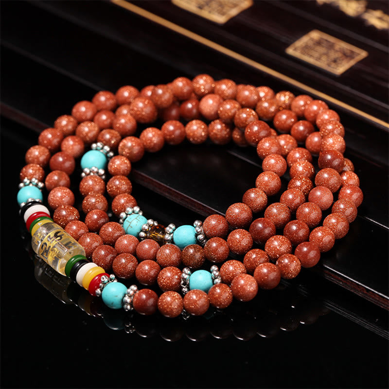 Buddha Stones 108 cuentas Mala Goldstone Om Mani Padme Hum esvástica pulsera de confianza