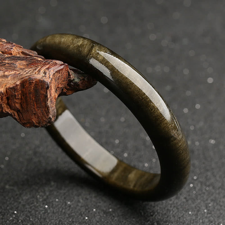 Brazalete de protección de obsidiana con brillo dorado y Buddha Stones