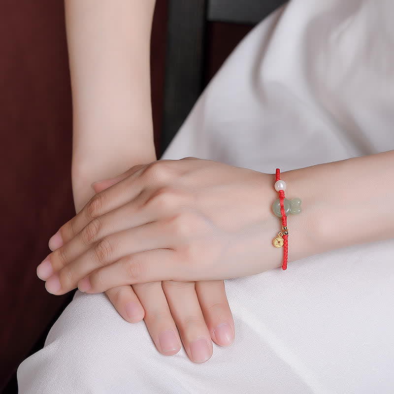 Pulsera de hilo rojo con moneda de cobre y jade hetiano del año del conejo en plata de ley 925