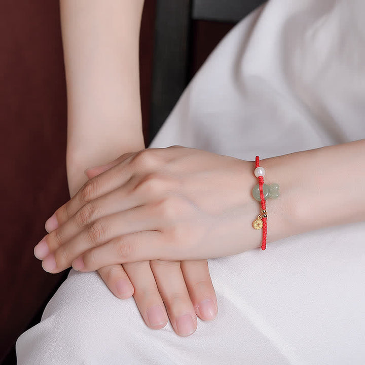 Pulsera de hilo rojo con moneda de cobre y jade hetiano del año del conejo en plata de ley 925