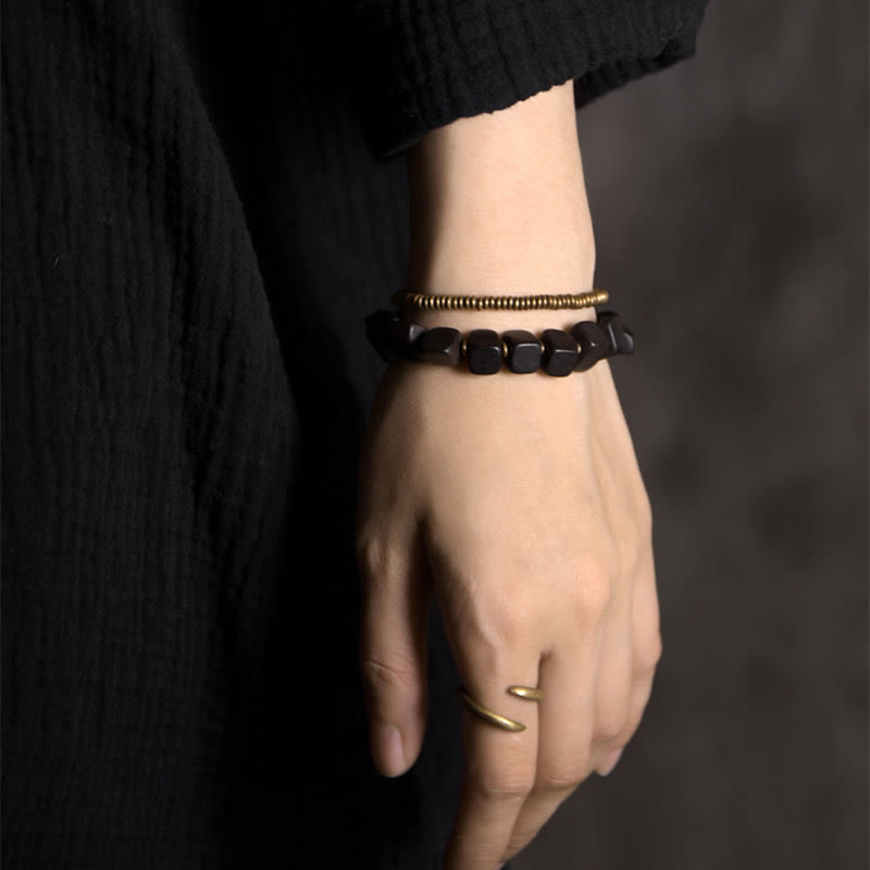 Pulsera de doble envoltura de paz de cobre y madera de ébano tibetano con Buddha Stones
