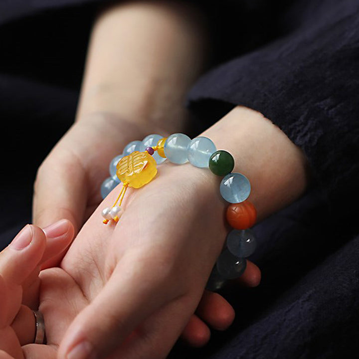 Pulsera de la paz con dije anudado chino, ámbar, aguamarina natural