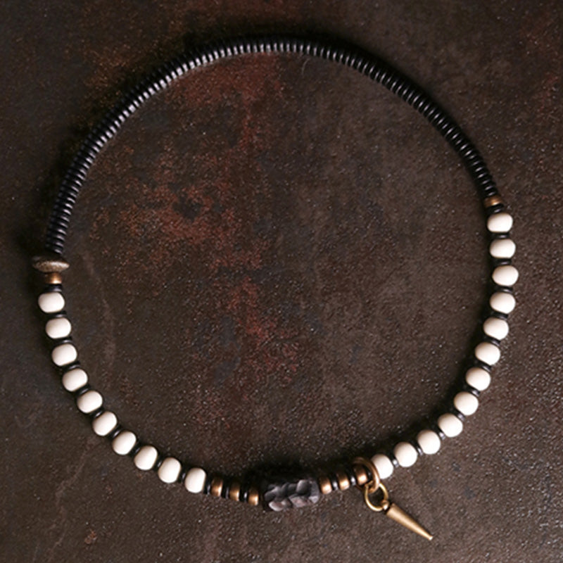 Pulsera de pareja con Buddha Stones, cuentas de hueso, madera de ébano y cobre.