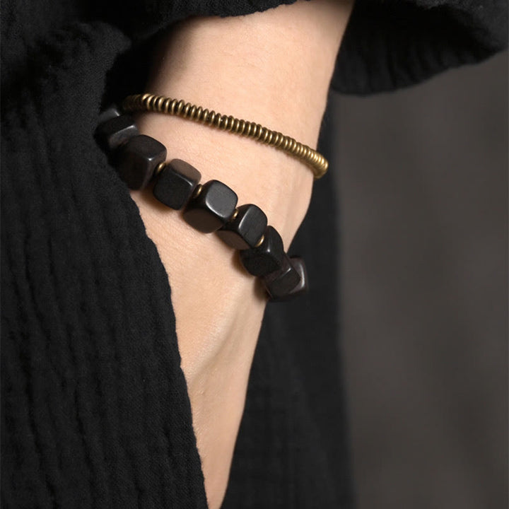 Pulsera de doble envoltura de paz de cobre y madera de ébano tibetano con Buddha Stones