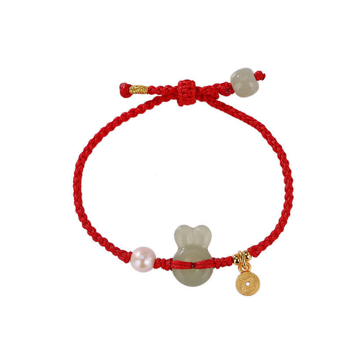 Pulsera de hilo rojo con moneda de cobre y jade hetiano del año del conejo en plata de ley 925