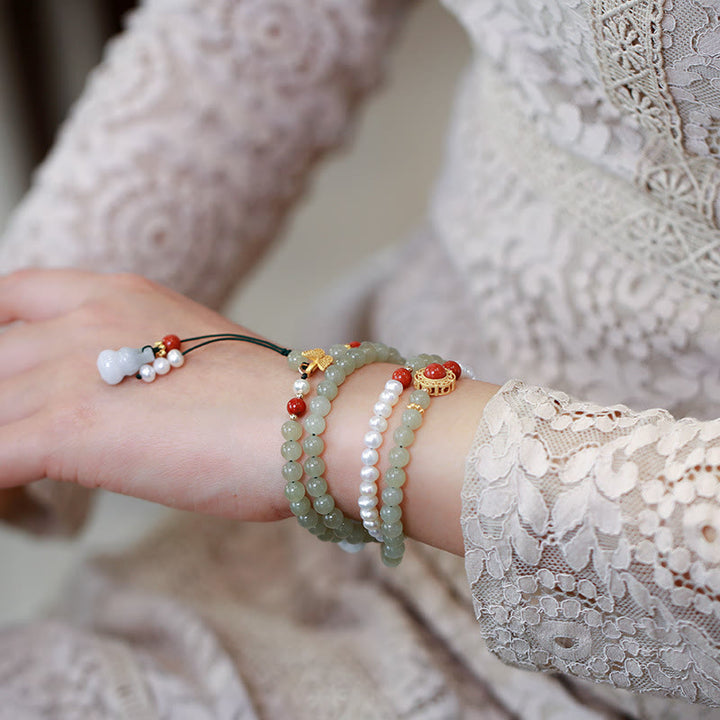 Pulsera de la suerte de la calabaza de la mariposa de la perla del jade hetiano natural del oro plateado de plata esterlina de las Buddha Stones