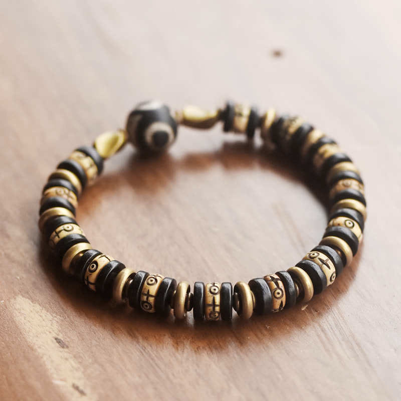 Pulsera de fuerza de madera de ébano con cuentas de hueso tibetano y piedras de Buddha Stones