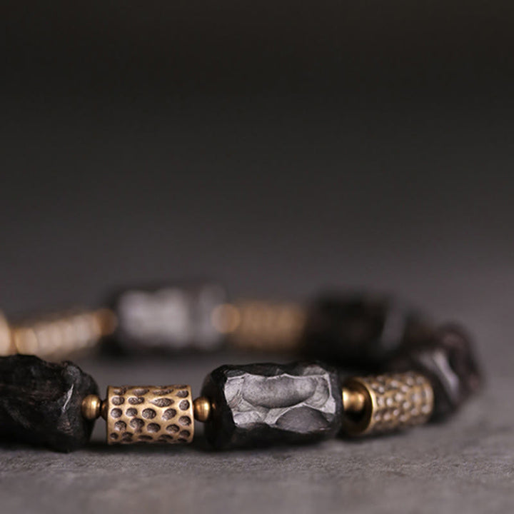 Pulsera de paz tranquila de cobre y madera de ébano tibetano con Buddha Stones