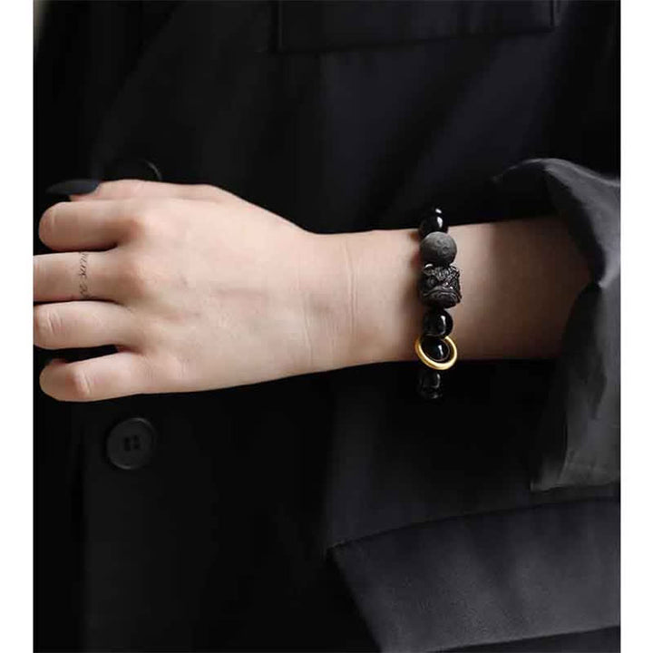 Pulsera de fuerza de león de obsidiana con brillo plateado de obsidiana negra