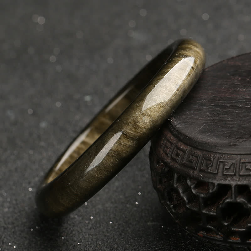 Brazalete de protección de obsidiana con brillo dorado y Buddha Stones