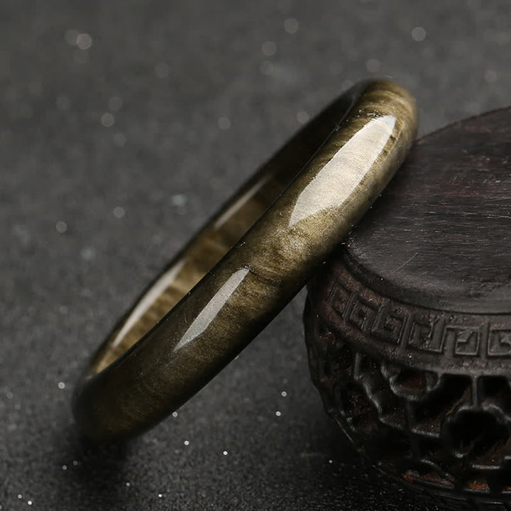 Brazalete de protección de obsidiana con brillo dorado y Buddha Stones