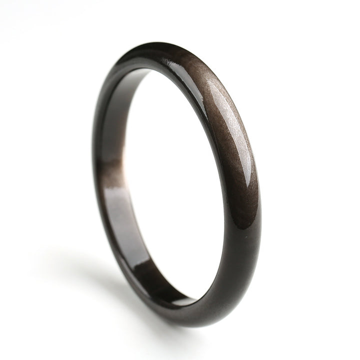 Brazalete de protección de obsidiana con brillo dorado y Buddha Stones