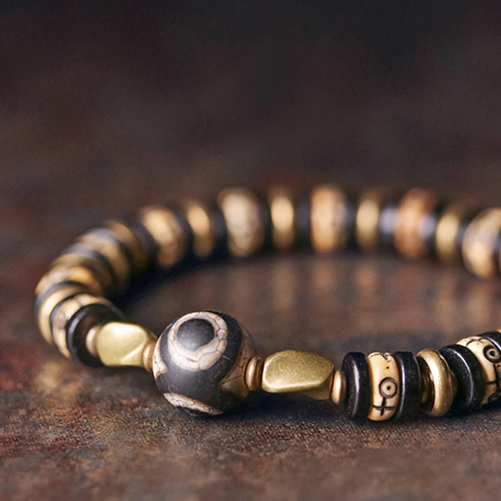 Pulsera de fuerza de madera de ébano con cuentas de hueso tibetano y piedras de Buddha Stones