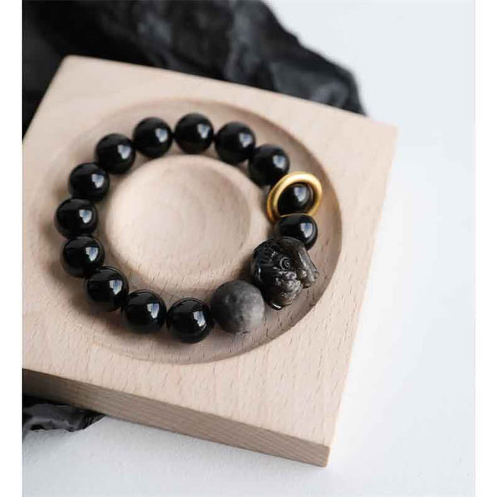Pulsera de fuerza de león de obsidiana con brillo plateado de obsidiana negra