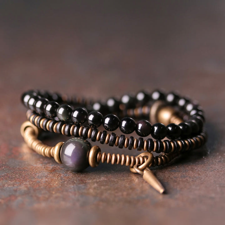 Pulsera de triple envoltura curativa de cobre y madera de ébano, obsidiana arcoíris con Buddha Stones