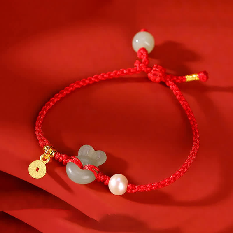 Pulsera de hilo rojo con moneda de cobre y jade hetiano del año del conejo en plata de ley 925