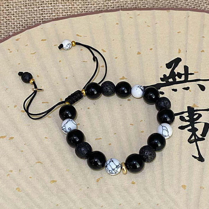 Pulsera de fuerza Yin Yang de piedra de roca de lava de obsidiana negra con Buddha Stones