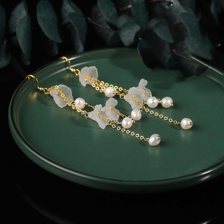 Pendientes colgantes de la suerte con pétalos de flores y perlas de Buddha Stones