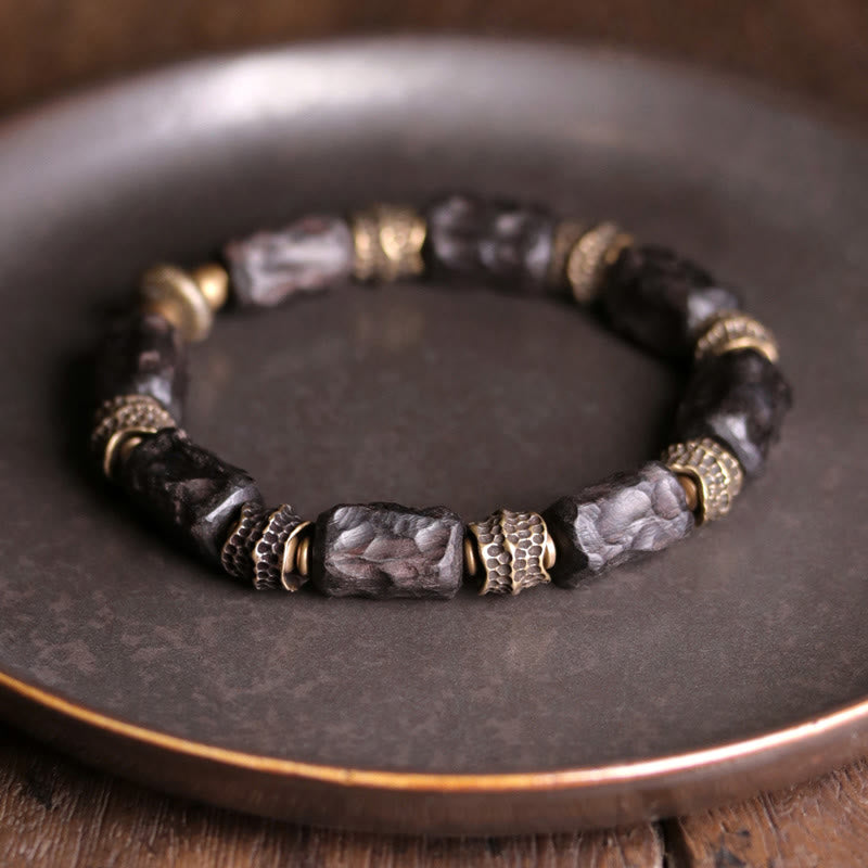 Pulsera de paz tranquila de cobre y madera de ébano tibetano con Buddha Stones