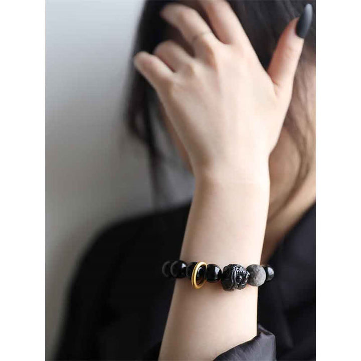 Pulsera de fuerza de león de obsidiana con brillo plateado de obsidiana negra