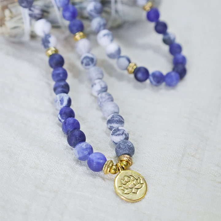 Pulsera con colgante de loto con cuentas de Mala de piedra azul y jaspe Picasso Natural 108 de Buddha Stones
