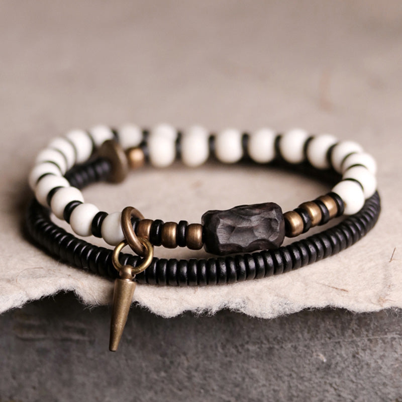 Pulsera de pareja con Buddha Stones, cuentas de hueso, madera de ébano y cobre.