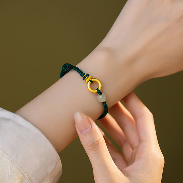 Pulsera trenzada de cuerda verde de la suerte con cuentas de jade hetiano y hebilla de la paz de plata de ley 999 con Buddha Stones