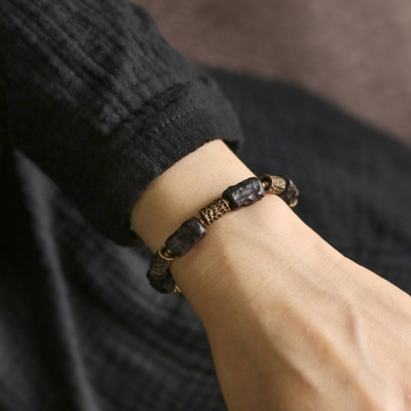Pulsera de paz tranquila de cobre y madera de ébano tibetano con Buddha Stones