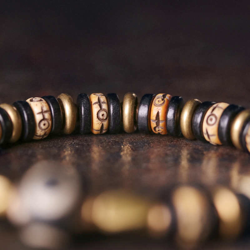Pulsera de fuerza de madera de ébano con cuentas de hueso tibetano y piedras de Buddha Stones