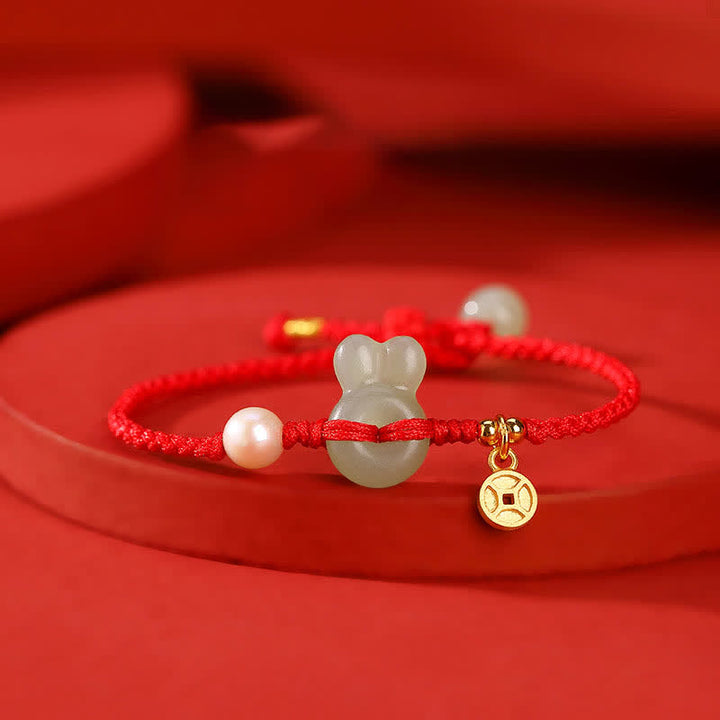 Pulsera de hilo rojo con moneda de cobre y jade hetiano del año del conejo en plata de ley 925