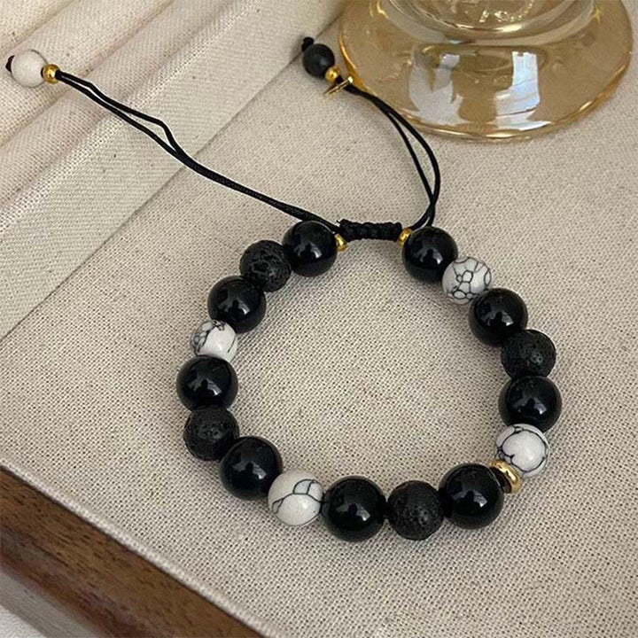Pulsera de fuerza Yin Yang de piedra de roca de lava de obsidiana negra con Buddha Stones