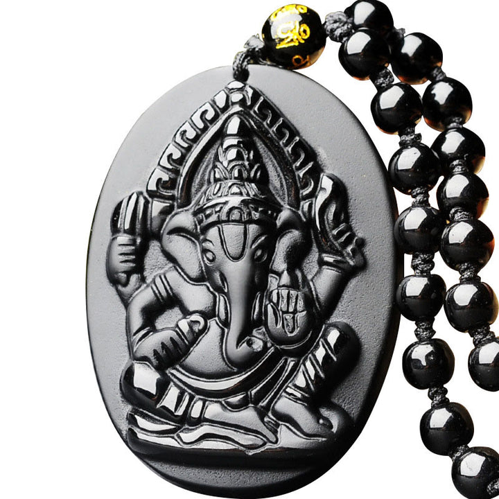 Collar con amuleto de riqueza de elefante Ganesh Ganpati de obsidiana tibetana con Buddha Stones