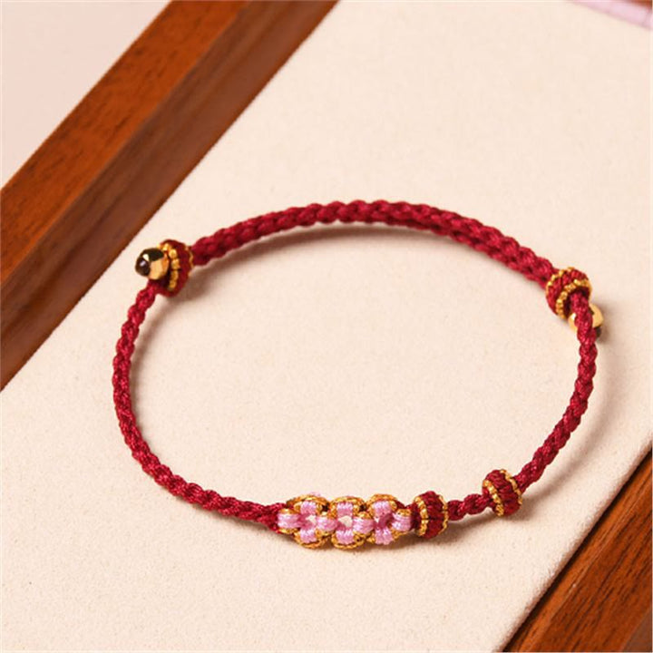 Pulsera de cuerda trenzada con protección de flor de melocotón hecha a mano con Buddha Stones