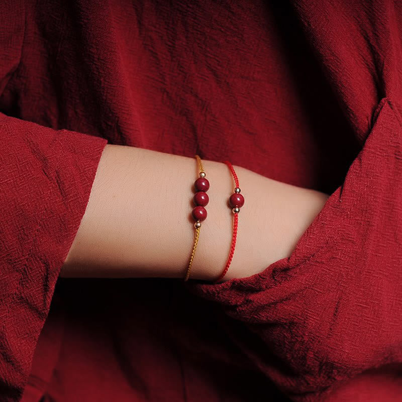 Pulsera trenzada con cadena de bendición de cinabrio natural chapada en oro de 14 quilates con Buddha Stones