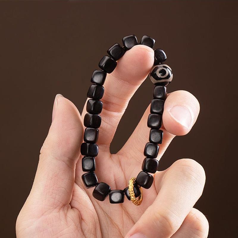 Pulsera de equilibrio de cuentas Dzi de madera de ébano tibetano con Buddha Stones
