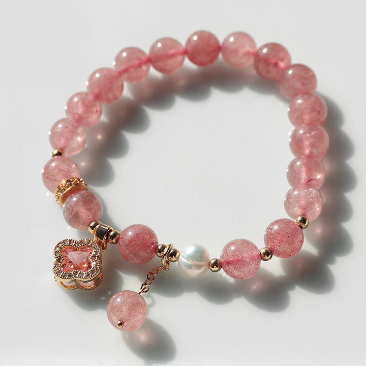 Pulsera curativa con dije de trébol de cuatro hojas y perlas de cuarzo fresa con Buddha Stones