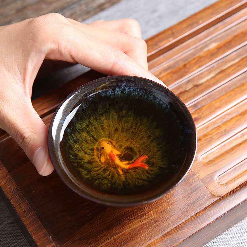 Buddha Stones, pequeño pez Koi, cambio de horno azul, taza de té de cerámica china Jianzhan, taza de té de Kung Fu 75ml