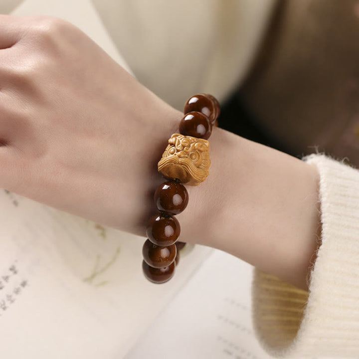 Pulsera de sabiduría de león danzante con semillas de Bodhi moradas con Buddha Stones