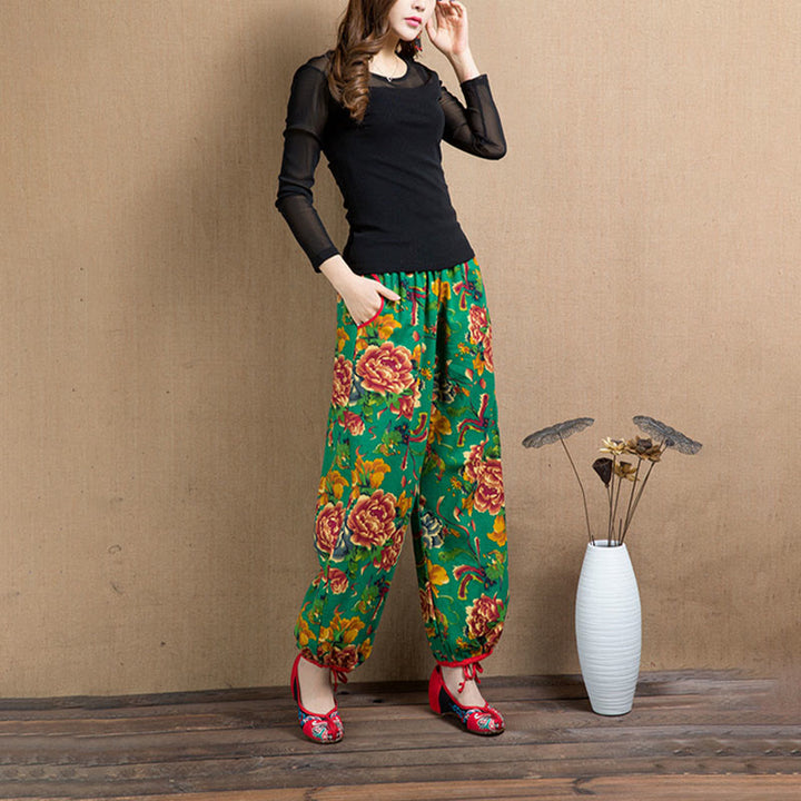 Pantalones bombachos con estampado de flores rojas y verdes de estilo étnico con Buddha Stones y bolsillos
