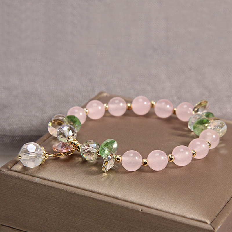 Pulsera con dije de paz y cristal rosa con ojo de gato y Buddha Stones