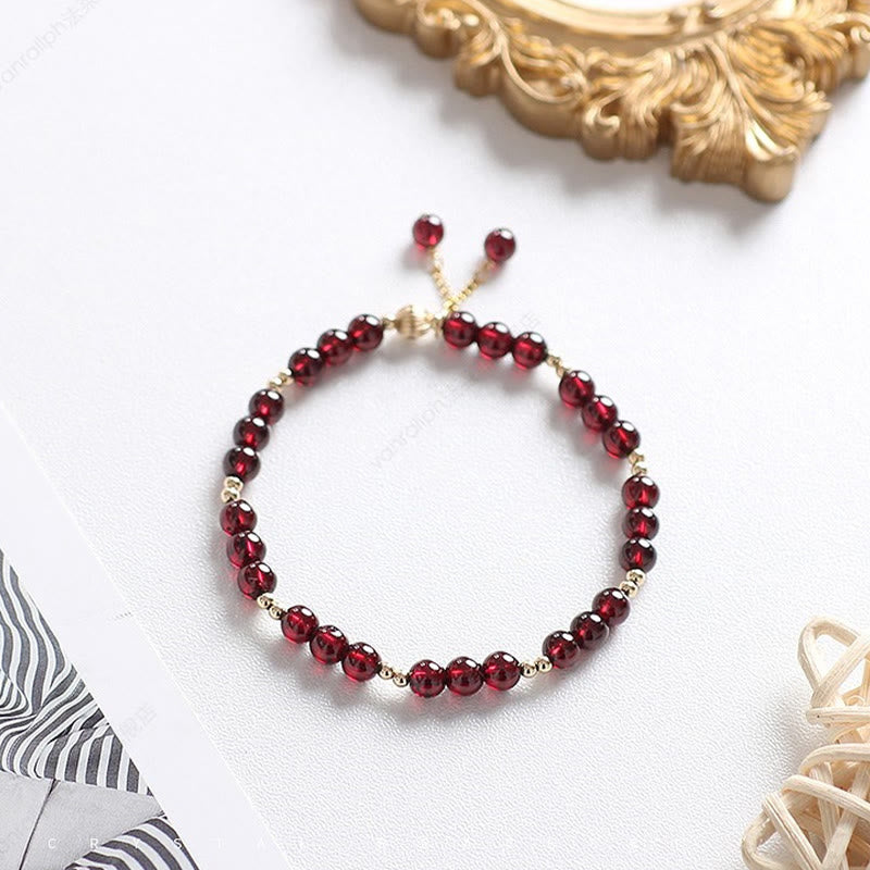 Pulsera Calm de granate natural de oro de 14 quilates con Buddha Stones