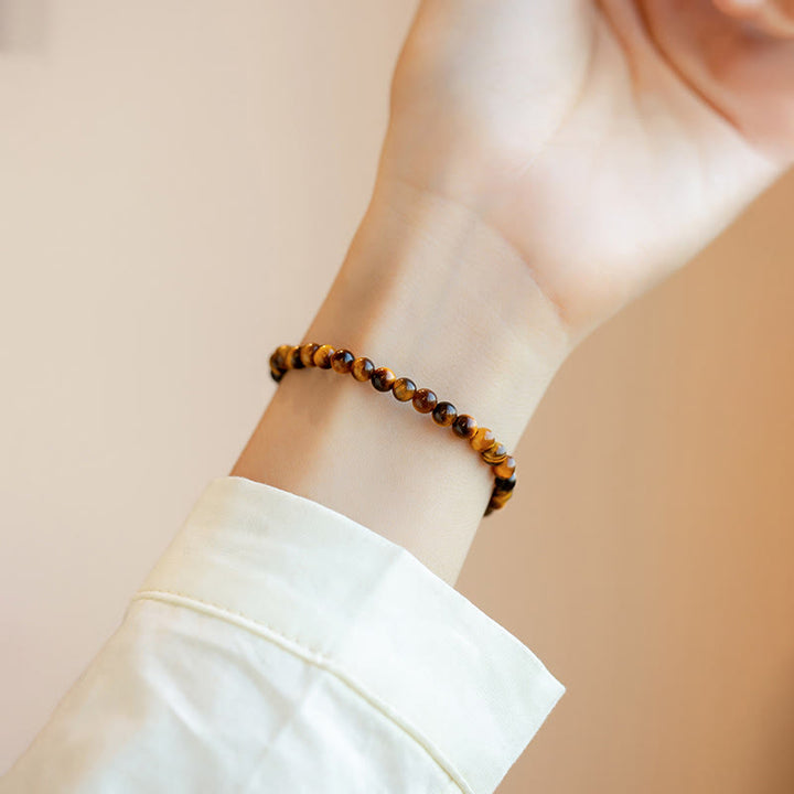 Buddha Stones Pulsera de protección de coraje con piedra de ojo de tigre natural chapada en oro de 14 quilates