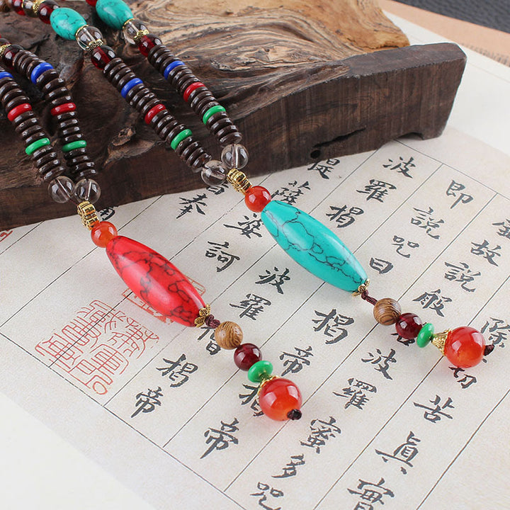 Buddha Stones Madera de wengué Piedra turquesa Protección Calma Collar Colgante